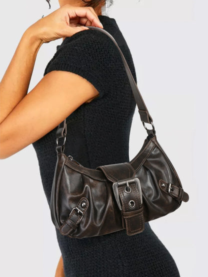 Vintage-inspired Y2K style leather shoulder bag with a structured silhouette in rich brown tones.